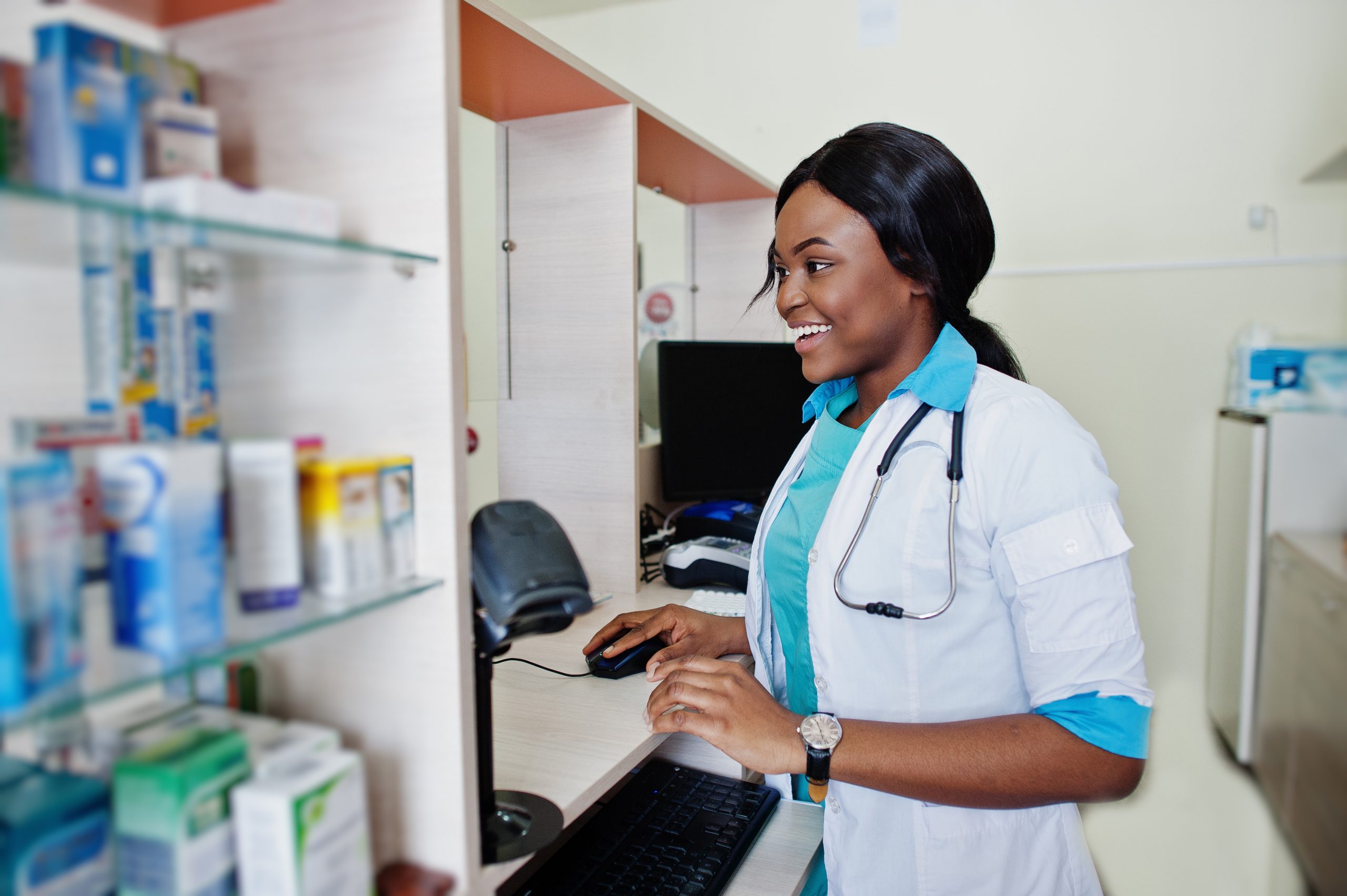 African american pharmacist working in drugstore at hospital pha